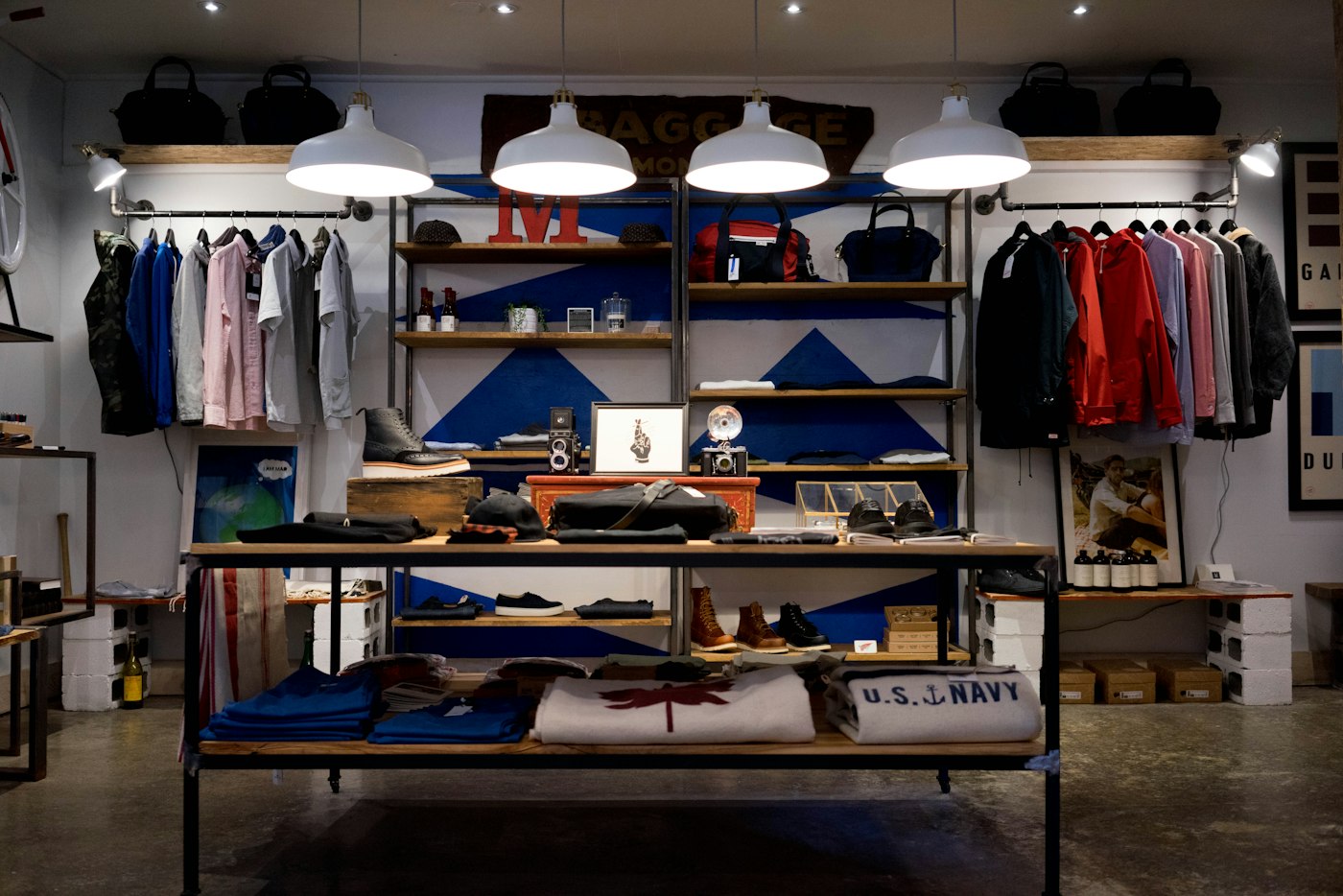 Inside a menswear boutique, shirts hanging on rails